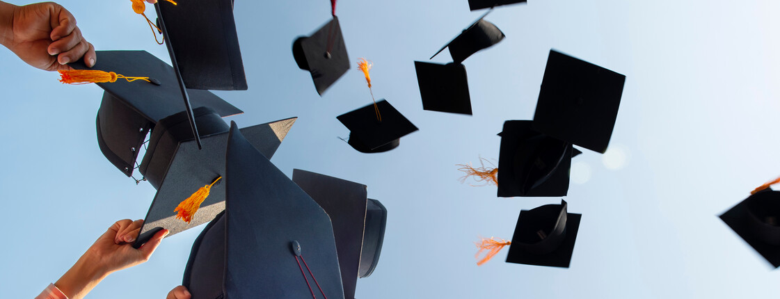 The,Students,Holding,A,Shot,Of,Graduation,Cap,By,Their The,Students,Holding,A,Shot,Of,Graduation,Cap,By,Their